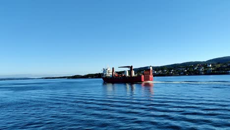 RO-RO-Cargo-ship-Hanna-Kristina-from-Larvik-Shipping-sailing-along-the-coast-of-Norway-in-sunny-weather---Partly-battery-powered-hybrid-vessel