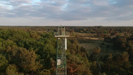 Observation-tower-of-forestry-area,-push-out-aerial-view