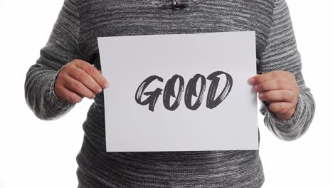 A-person-holding-a-sign-with-the-message-and-the-word-"good