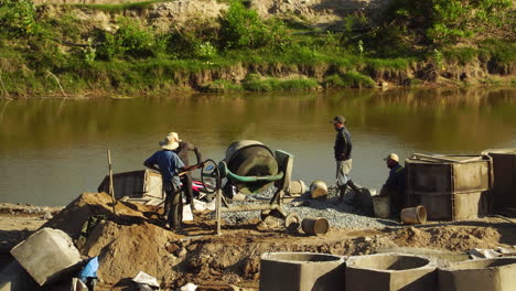 Workers-prepare-cement-for-construction-of-river-bed