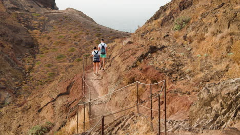 Couple-Hiking-At-The-Rugged-Landscape-Of-Ponta-De-Sao-Lourenco-In-Madeira-Island,-Portugal