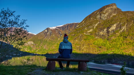 boy-admires-amazing-view-from-lookout-in-Aurland-fiord,-Flam-village