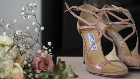 Brides-Wedding-Strap-On-Shoes-And-Flower-Arrangement-Details,-SLOW-MOTION