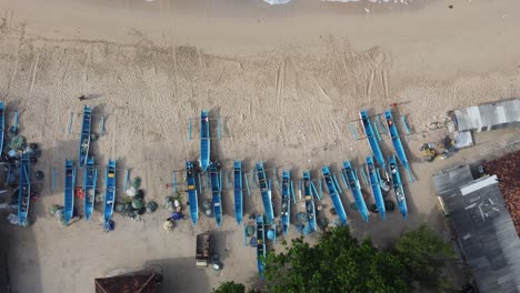 Aerial-top-view-of-fishermen's-boats-from-above-near-beach