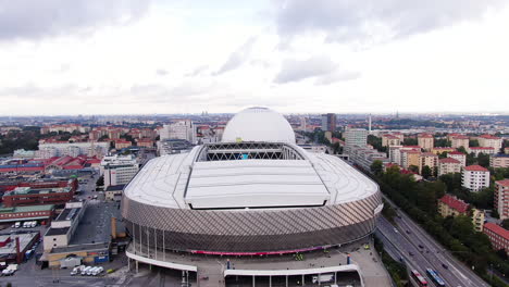 Tele-2-arena-and-cityscape-with-traffic-of-Stockholm-city,-aerial-view