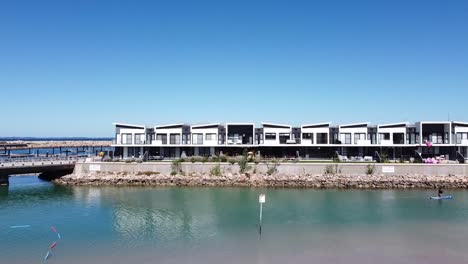 Aerial-Takeoff-Over-Port-Coogee-Beach-And-Waterfront-Development