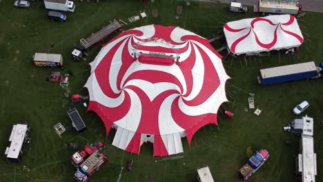 Planet-circus-daredevil-entertainment-colourful-swirl-tent-and-caravan-trailer-ring-aerial-Birdseye-view