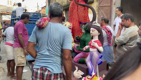 Local-people-picking-Durga-Maa-Idols-for-transporting-to-local-puja-pandals-during-Durga-Puja-in-Kolkata