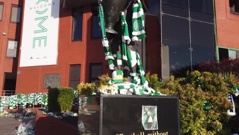 Close-up-of-the-statue-of-Celtic-FC-legend-Jock-Stein-with-scarves-being-tied-around-him