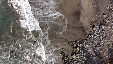 Top-down-aerial-drone-view-of-a-rugged-beach-in-Northern-Tenerife,-Anaga-National-Park