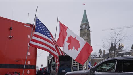 Freedom-Convoy-Trucker-Protest-Ottawa-Ontario-Canada-2022-COVID-19-Anti-Vaccine-Anti-Mask-Flags-on-Truck-in-Front-of-Parliament-Hill