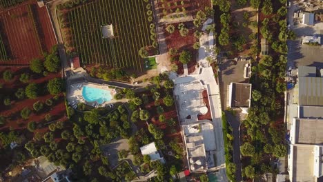 Top-view-by-drone-of-a-swimming-pool-in-the-marche,-italy