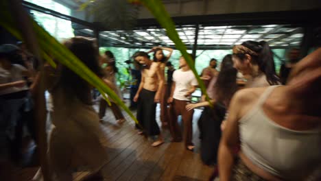 Asian-men-and-women-throwing-hair-wildly-in-the-heat-of-ecstatic-dance-jam