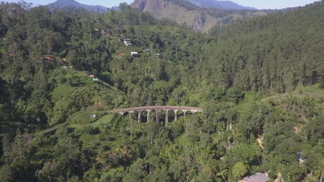 Aerial-retreats-from-mountainous-Nine-Arch-trestle-bridge-in-Sri-Lanka