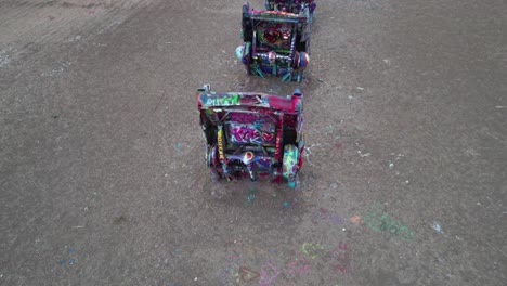 Birds-Eye-Aerial-View-of-Cadillac-Ranch,-Painted-Cars-as-Art-Installation-Near-Amarillo,-Texas-USA,-Drone-Shot