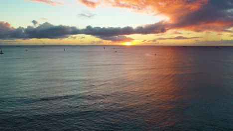 Aerial-Drone-Reveal-of-Picturesque-Hawaiin-Ocean-Sunrise-Over-Waikiki-Beach-In-Honolulu