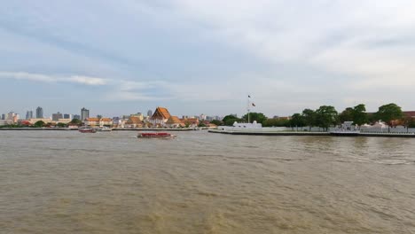 Bangkok-city-skyline-with-Wat-Kalayanamit-Woramahawihan-Temple-by-the-Chao-Phraya-River-waterfront---realtime
