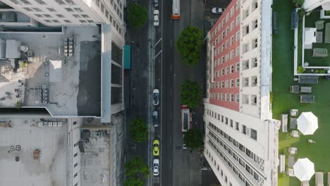 Birdseye-View-of-City-Streets-in-Downtown-Los-Angeles,-Rooftop-Terraces-and-Cars