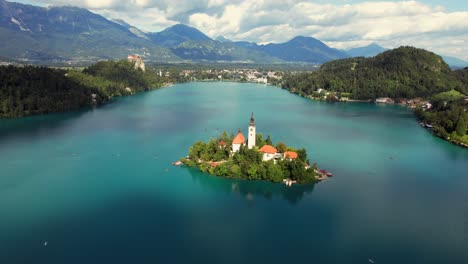 Lake-Bled-in-the-town-of-Bled-is-a-popular-tourist-destination,-and-mostly-known-for-the-small-island-in-it-with-the-pilgrimage-church-among-other-buildings