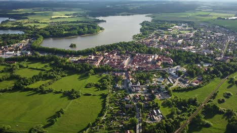 Aerial-view-of-a-small-historic-town-of-Trebon-surrounded-by-protected-landscape-area-with-a-muddy-pond-and-rich-fauna-and-flora