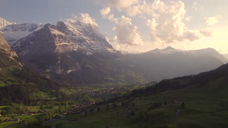 Aerial-drone-footage-pushing-out-revealing-moody-views-of-picturesque-mountain-village-in-front-of-eiger-north-face