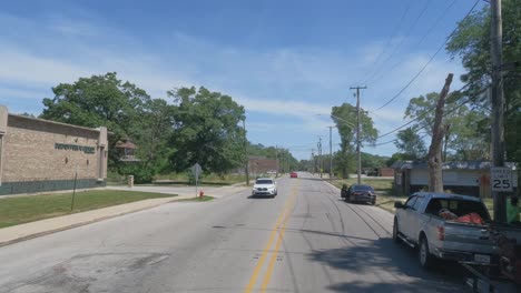 Traveling-in-Dolton-Illinois-area,-suburbs,-and-streets-in-POV-mode-passing-park-truck