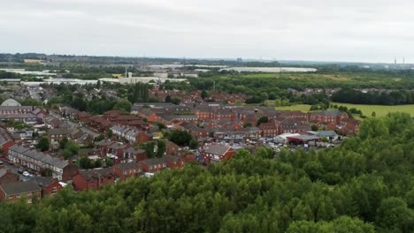 Residential-homes-aerial-view-suburban-British-town-woodland-neighbourhood-community