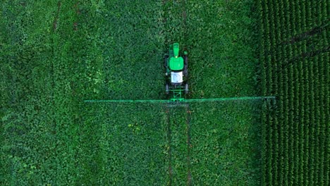 Top-down-aerial-of-John-Deere-sprayer-in-pumpkin-field