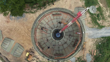 Downward-angle-drone-shot-of-a-water-tower-under-construction