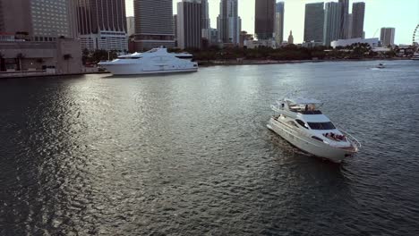 Aerial-view-around-a-yacht-in-sunny-Brickell,-Miami,-USA---circling,-drone-shot