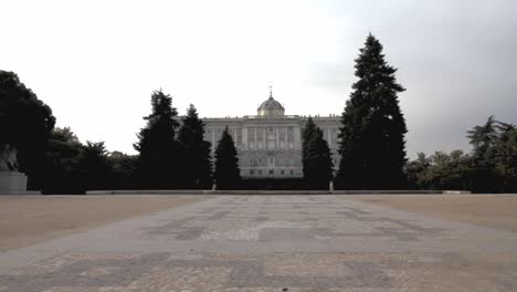 Travelling-forward-in-Jardines-de-Sabatini-approaching-the-Palacio-Real-in-Madrid
