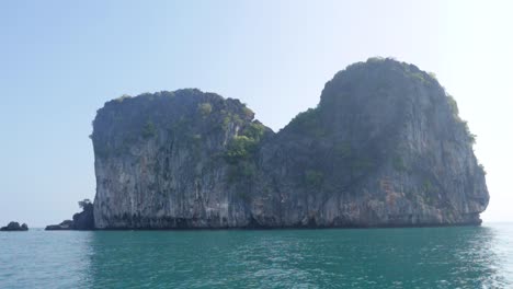 Ultra-slow-motion-shot-of-giant-limestone-rock-with-vegetation-in-Thailand