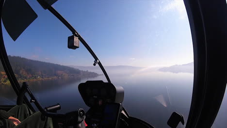 Helicoprer-flying-low-over-a-lake-in-Chile,-in-Ful-HD-at-60fps