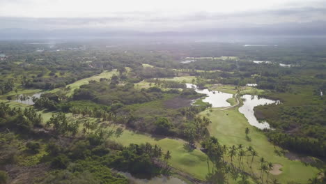 Aerial-of-sunny,-tropical-golf-course-in-Mexico
