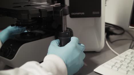 Pharmaceutical-lab-adjusting-microscope-CLOSE-UP