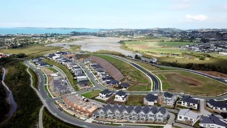 aerial-view-of-a-new-suburb,-development-and-construction-site-in-Auckland,-New-Zealand