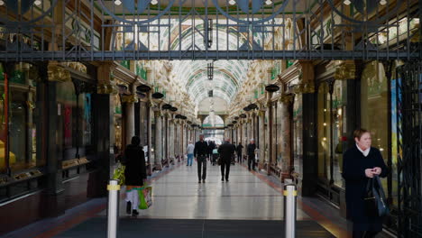 Shoppers-stroll-through-the-beautiful-Leeds-arcade-in-slow-motion