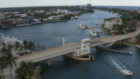 Aerial-view-of-bridge-with-some-cars-moving-across-then-the-bridge-starts-to-rise-for-oncoming-water-traffic