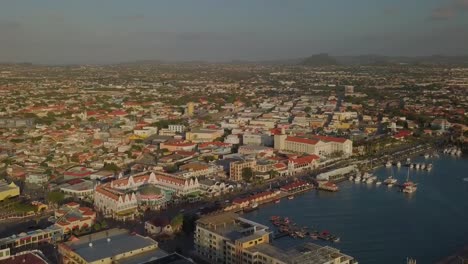 Aerial-pan-view-of-the-beautiful-marina-and-busy-streets-in-the-city-Oranjestad-of-Aruba