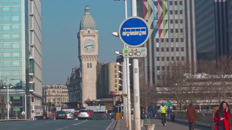 A-slow-zoom-on-the-clock-tower-of-Gare-de-Lyon-train-station-in-Paris-from-the-bridge-Charles-de-Gaulle-on-a-bright-sunny-day-at-noon