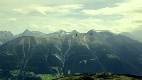 Still-slow-motion-shot-of-Switzerland-mountains-with-birds-flying