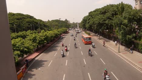 Timelapse-Aerial-view-of-five-lane-highway-traffic-near-City-Townhall-Bangalore,-India