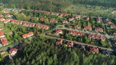 Aerial-view-of-a-new-housing-estate-in-the-suburbs,-drone-flying-around