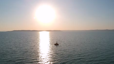 Sunset-and-a-Bouy-at-the-middle-of-the-lake-Balaton,-Hungary-Siofok-Recorded-with-a-Dji-drone-1080p