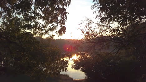 Aerial-shot-of-a-sunrise-over-a-lake