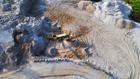 Aerial-orbit-shot-from-a-drone-of-quarry-and-heavy-machinery-in-pomeranian-district-in-Poland