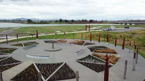 Aerial-fly-forward-into-the-compass-central-stone-by-the-Maori-in-Napier,-New-Zealand