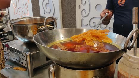 a-man-making-a-famous-sweet-in-delhi-in-one-of-the-marriage-functions-in-delhi-street-foods-making