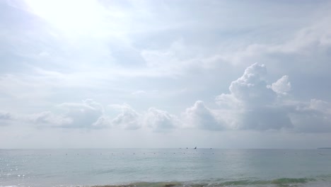 Landscape-view-of-the-andaman-sea-in-summer-daytime-with-some-wave-and-wind-blowing-in-Phuket,-Thailand---in-slowmotion-4k-UHD-video