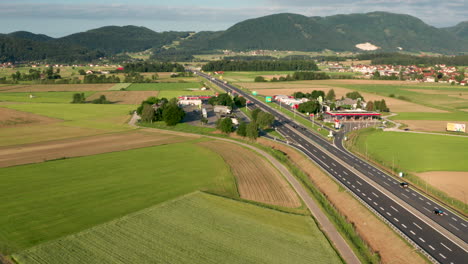 Aerial-view-of-truck-stop-on-highway-in-Slovenia,-Tepanje-rest-area-with-petrol-station